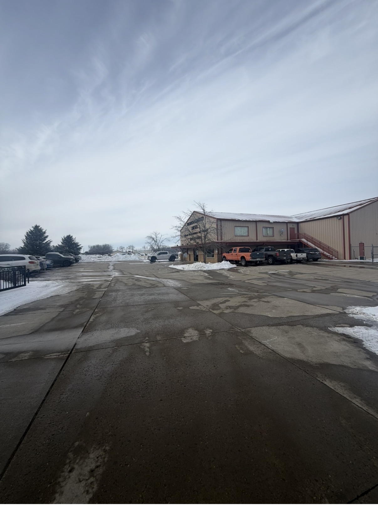 Cleared parking area outside a commercial building